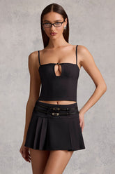 Belted Low-Rise Pleated Mini Skirt in Black