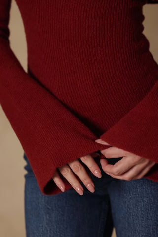 Ribbed-Knit Asymmetric Off-Shoulder Jumper in Brick Red