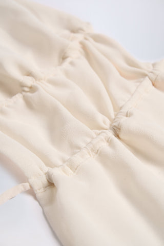 Cut-Out Semi-Sheer Ruched Halterneck Crop Top in Ivory