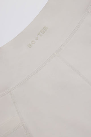 Soft Active Pocket V-Waist Mini Shorts in Cream