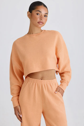 Textured Cotton Jersey Open-Back Cropped Sweatshirt in Peach