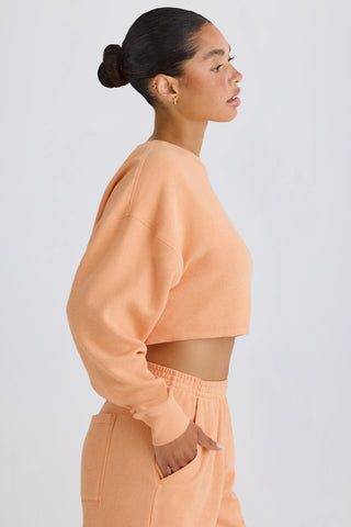 Textured Cotton Jersey Open-Back Cropped Sweatshirt in Peach