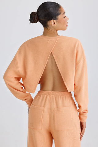 Textured Cotton Jersey Open-Back Cropped Sweatshirt in Peach